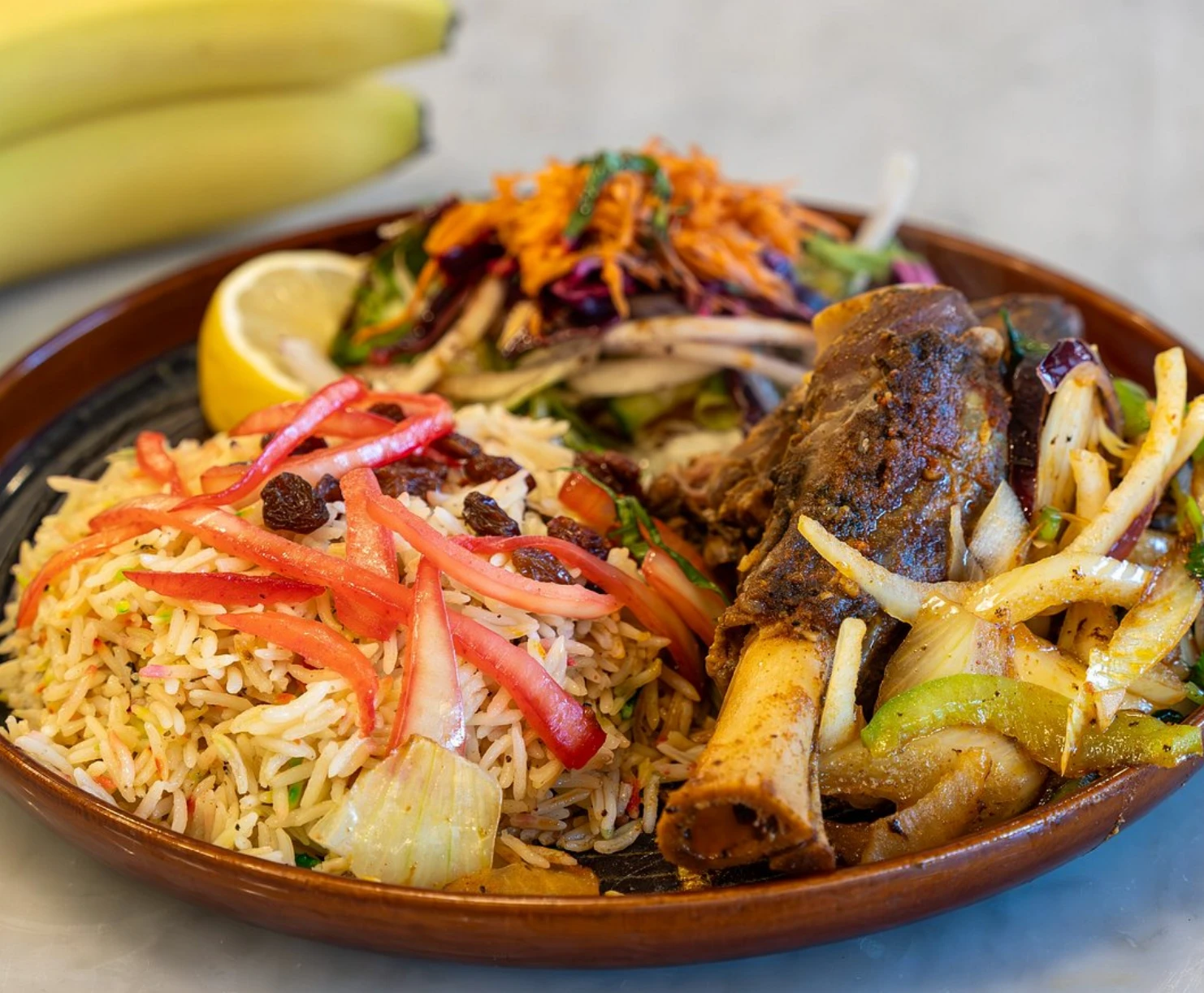 Haneeth with spiced rice and raisins